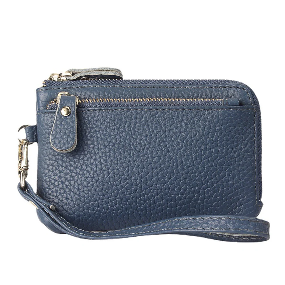 Porte-monnaie en cuir artisanal pour femme – Élégance et Artisanat Maroquinerie 6 Porte-monnaie bleu en cuir véritable, fabrication artisanale, avec fermeture éclair et multiples couleurs disponibles