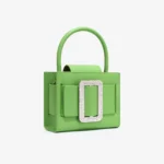 Sac en cuir vert avec boucle incrustée de diamants