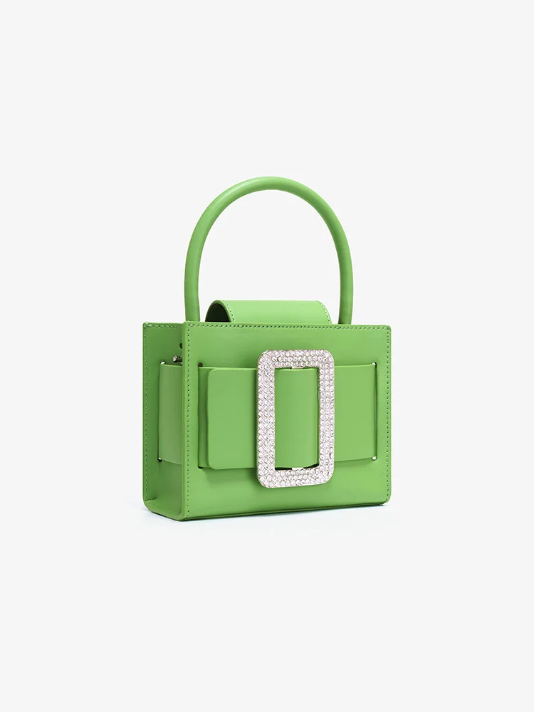 Sac en cuir vert avec boucle incrustée de diamants